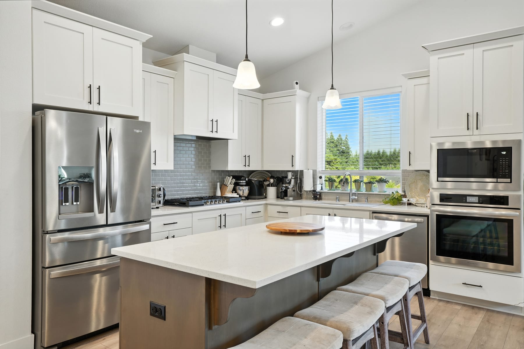 Open kitchen with stainless appliances and island